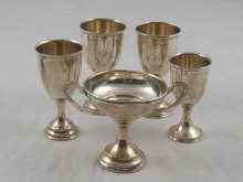 Appraisal: Four small goblets and a small challenge cup all uninscribed