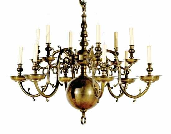 Appraisal: Chapman brass twelve-light chandelier turned column having scrolling arms terminating