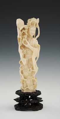 Appraisal: A Carved Ivory Quan Yin Carved with open work standing