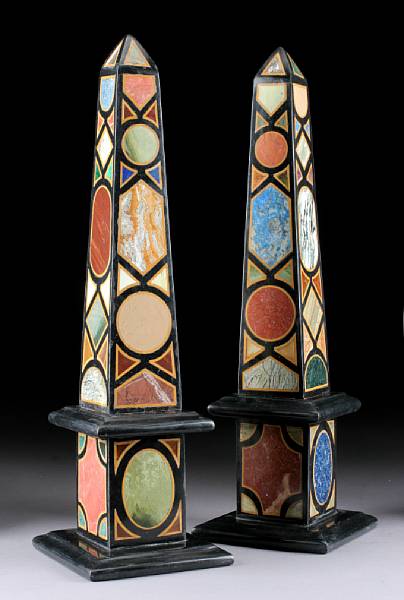 Appraisal: A pair of Baroque style specimen marble obelisks Of typical