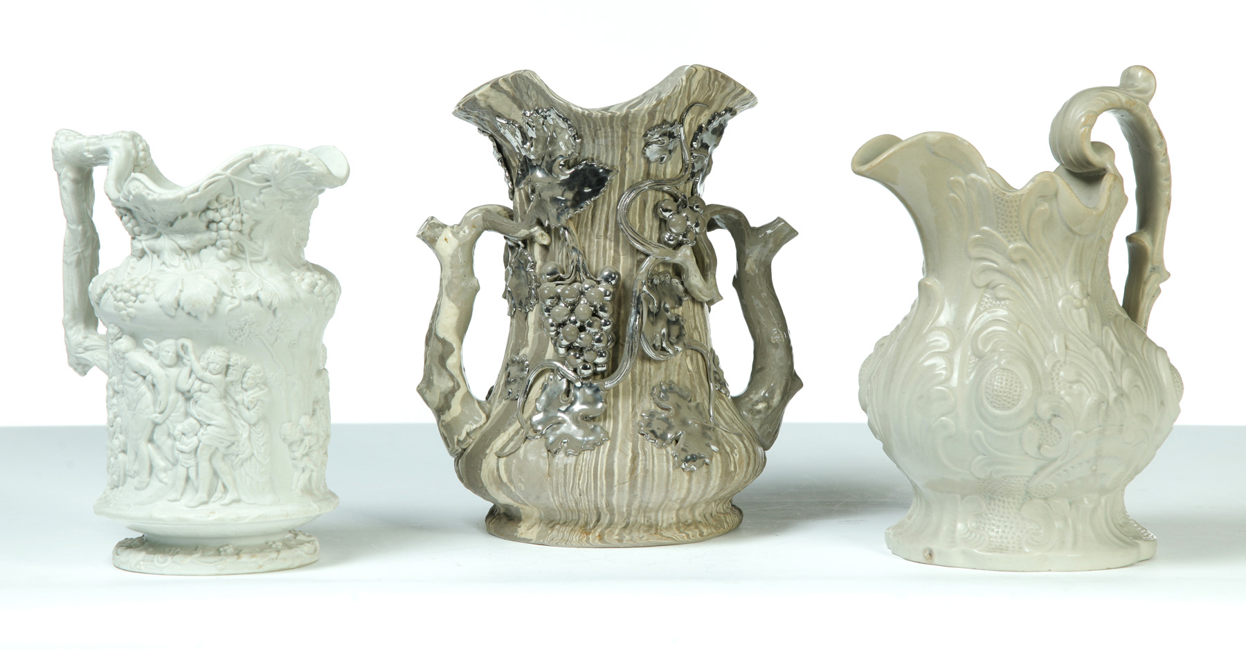 Appraisal: THREE RELIEF MOLDED PIECES OF WHITE CHINA Mid th century