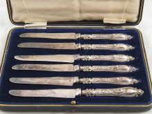 Appraisal: A boxed set of six dessert knives with silver handles