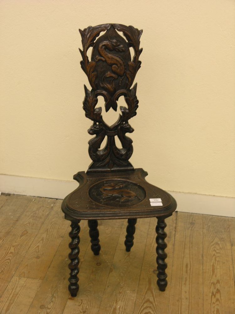 Appraisal: A Welsh dark oak spinning chair with boldly carved back