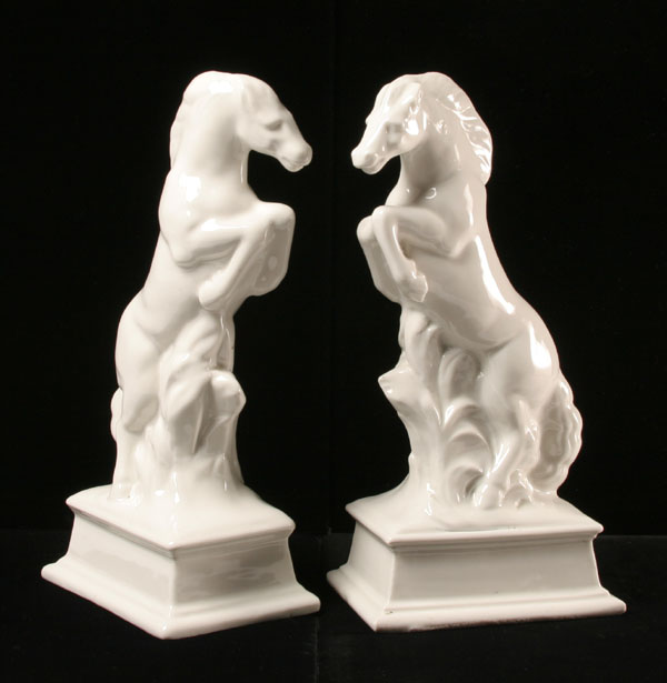 Appraisal: Pair glazed ceramic horses stylized rearing steeds on molded base