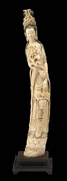 Appraisal: A large tinted ivory figure of Guanyin th Century Depicted