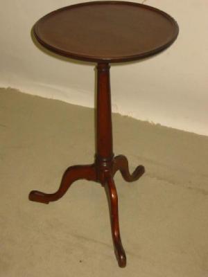 Appraisal: A GEORGE III MAHOGANY TRIPOD TABLE the dished circular top