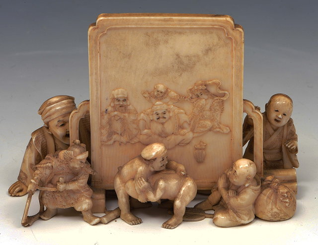 Appraisal: A Japanese ivory okimono groupMeiji periodsigned in Sosho the group