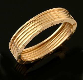 Appraisal: A gold bangle by Bulgari The hinged B Zero cuff