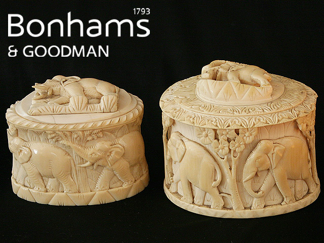 Appraisal: Two carved ivory boxes and covers with elephant decoration Two