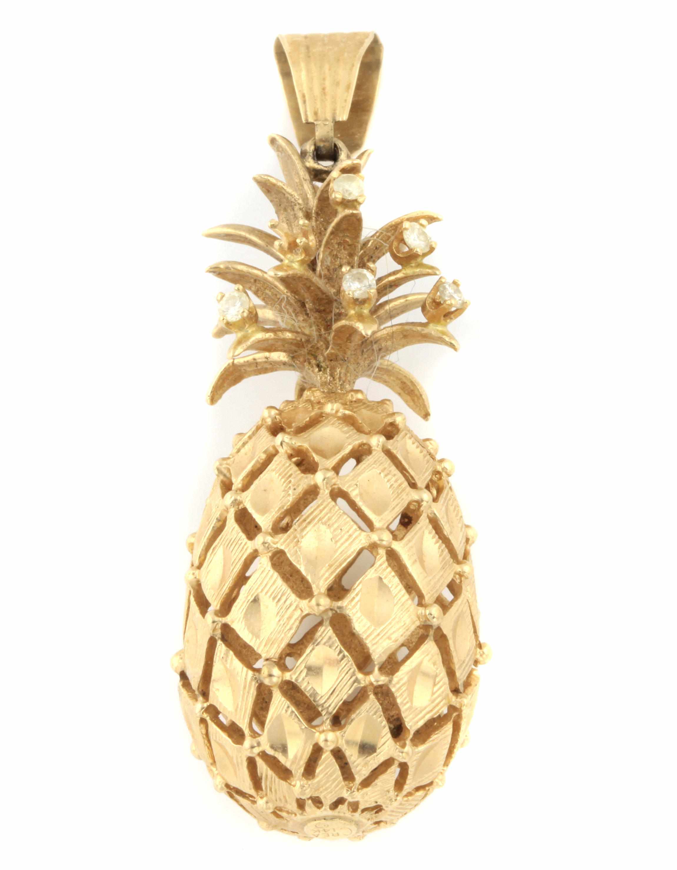 Appraisal: A k gold and diamond pineapple motif pendant dimensions x