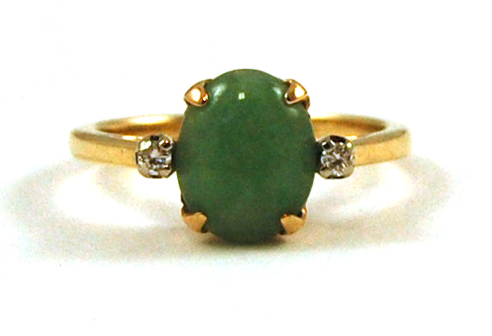 Appraisal: JADE DIAMOND AND FOURTEEN KARAT GOLD RING separating a pair