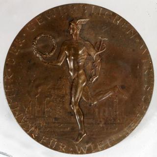 Appraisal: OKIENAUER SCULPTOR OLYMPIC BRONZE MEDAL OKIENAUER SCULPTOR OLYMPIC BRONZE MEDAL