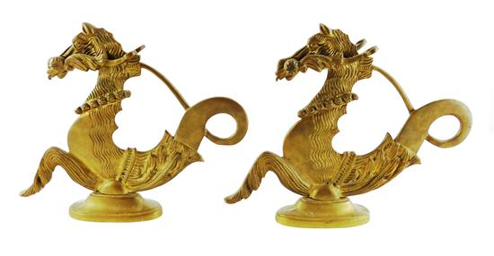 Appraisal: Pair of brass gondola seahorses with stylized detail arabesque tail