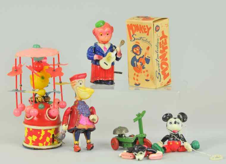 Appraisal: CELLULOID TOY GROUPING Japan lot includes animal whirligig Monkey playing