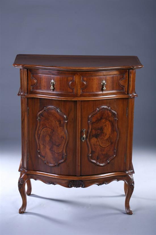 Appraisal: CONTINENTAL ROCOCCO STYLE CARVED WALNUT PETITE COMMODE th century Serpentine