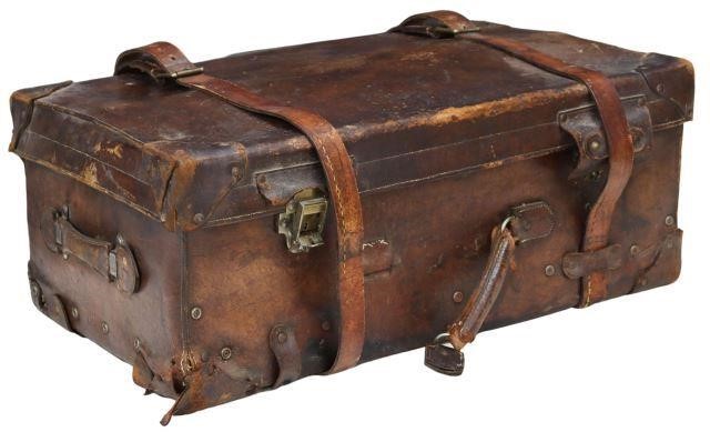 Appraisal: Leather travel trunk suitcase early th c having brass six