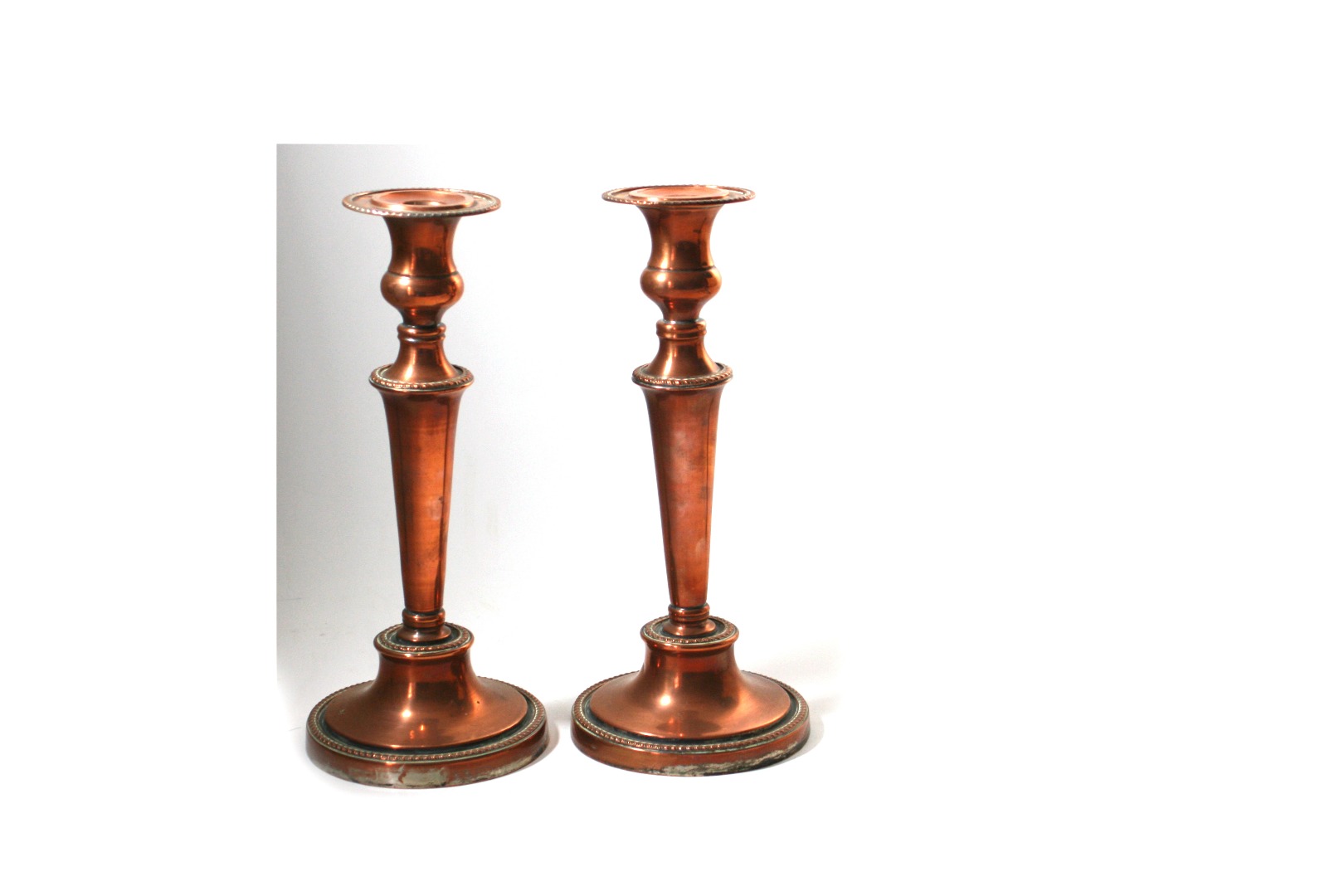 Appraisal: A pair of George III style electroplate on copper candlesticks