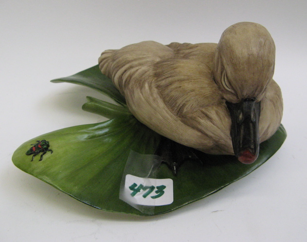 Appraisal: BOEHM BISQUE PORCELAIN FIGURE hand painted A sleepy-eyed duck resting