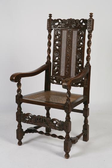 Appraisal: A CHARLES II STYLE OAK HIGH BACKED ARMCHAIR the top