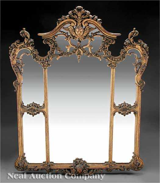 Appraisal: An Antique French Carved and Gilded Mirror the arched crest