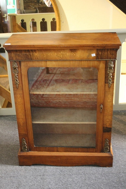 Appraisal: A VICTORIAN WALNUT PIER CABINET with satinwood inlay interior fitted