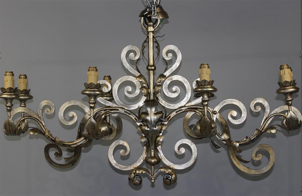 Appraisal: ROCOCO STYLE PATINATED SHEET METAL EIGHT-LIGHT CHANDELIER having an applied