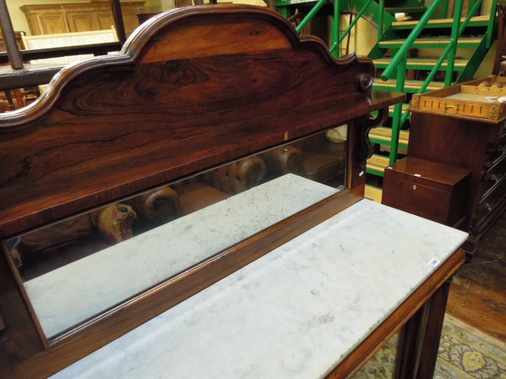 Appraisal: A Victorian rosewood veneered chiffonier the raised and shaped back