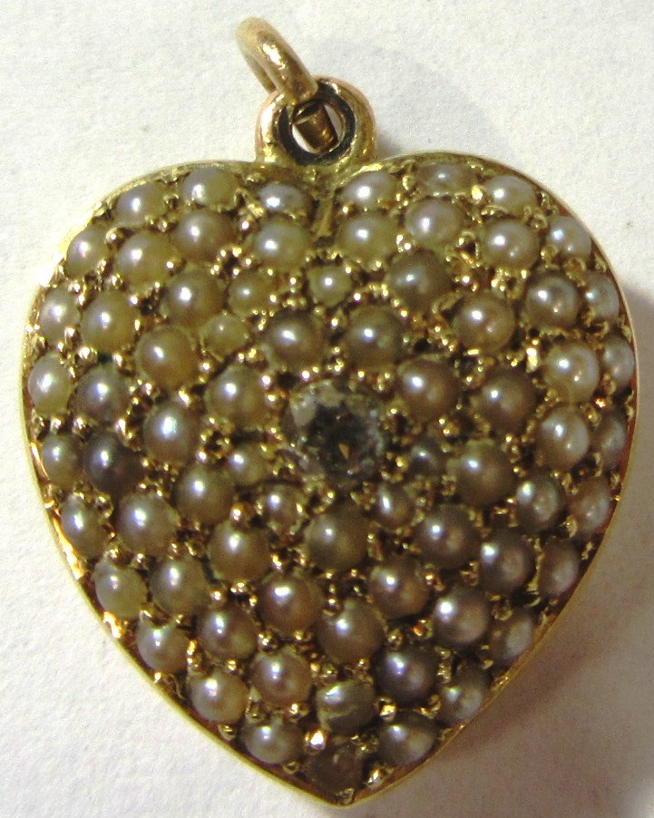 Appraisal: A gold diamond and seed pearl set pendant designed as