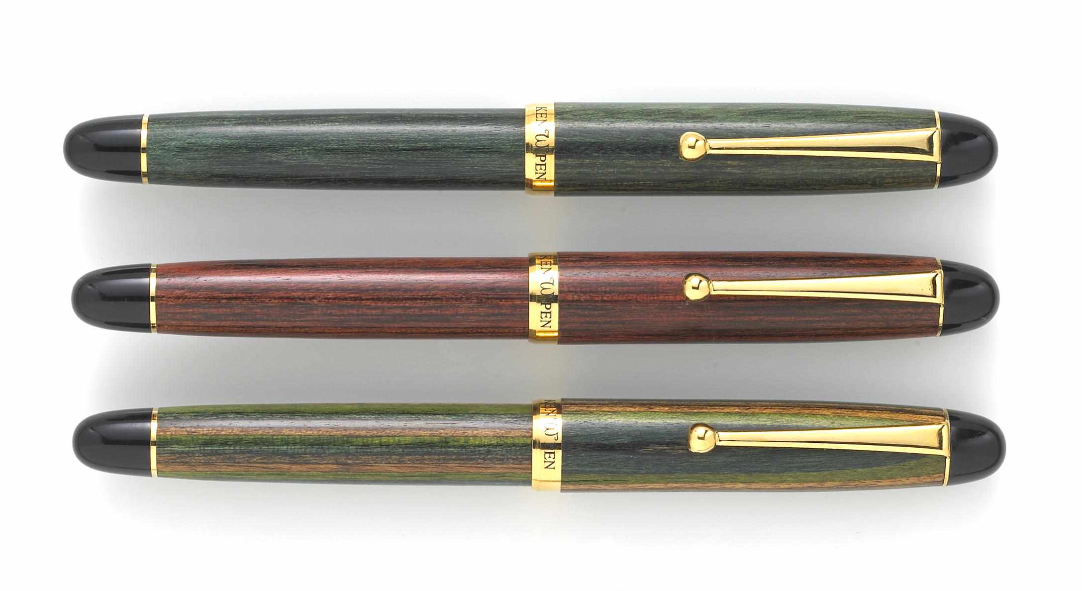 Appraisal: KENPEN Three Rollerball Pens Comprising rosewood Tahitian jade wood and