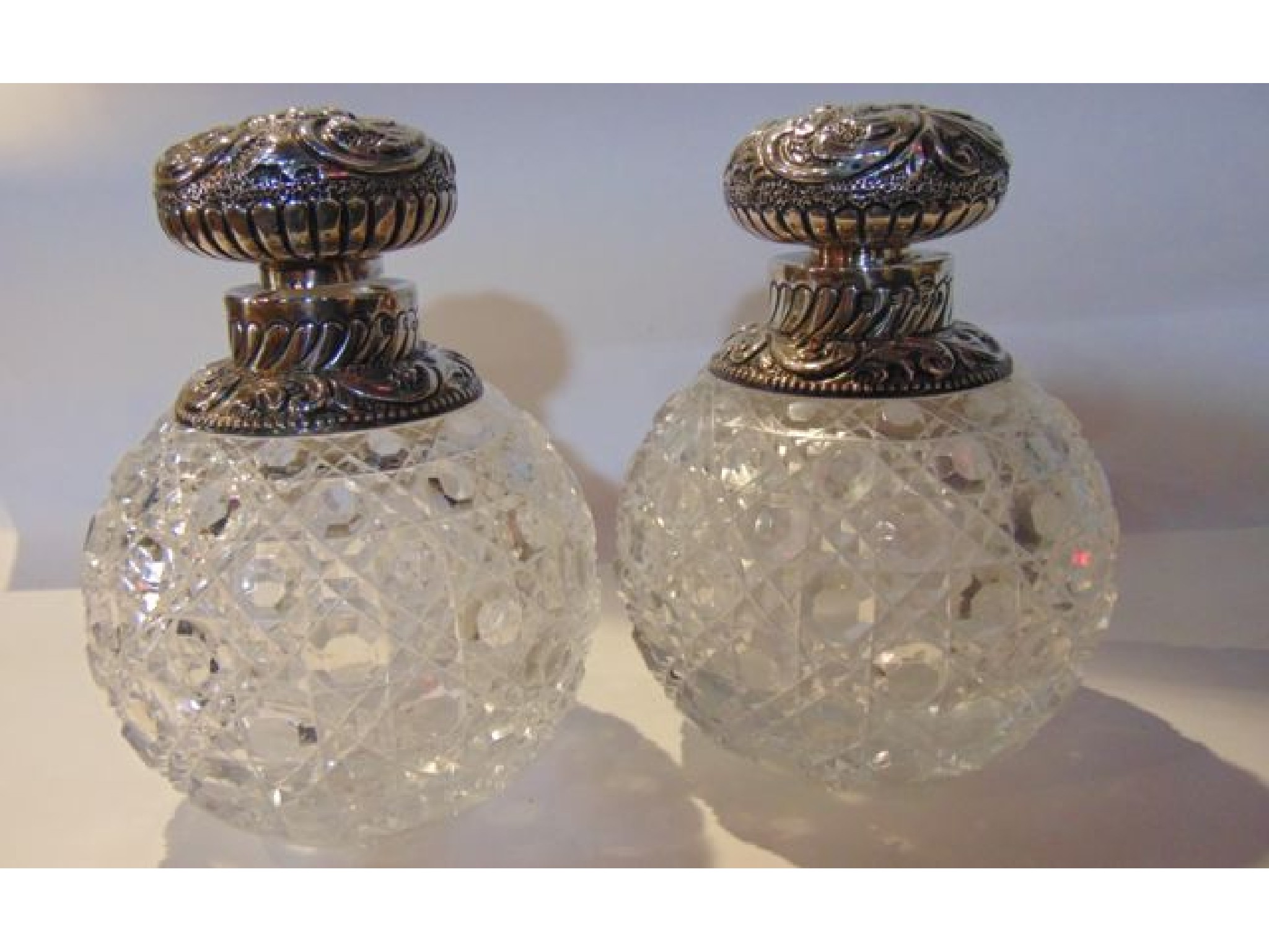 Appraisal: A pair of Victorian silver-mounted cut-glass scent bottles Rosenthal Jacob