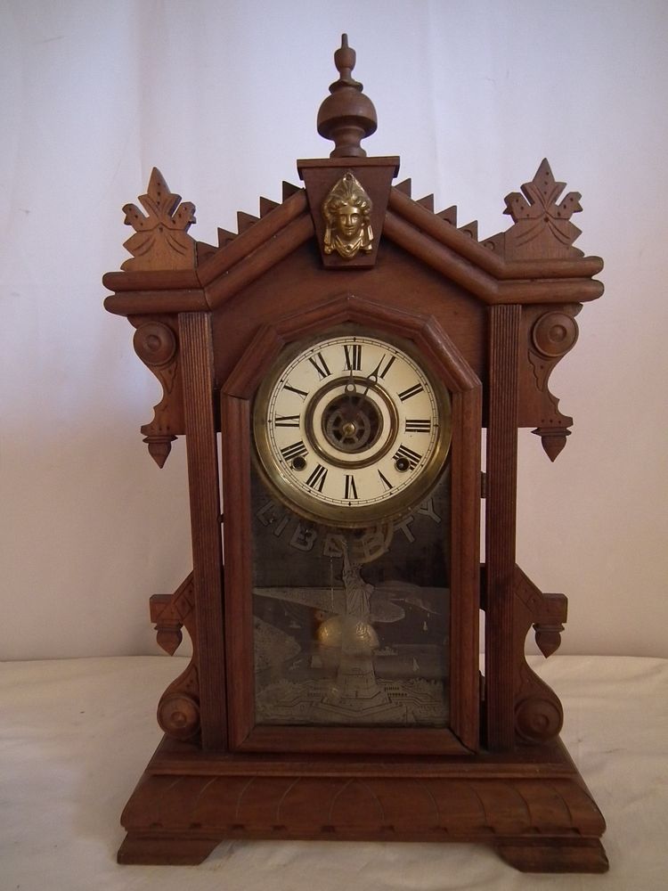 Appraisal: STATUE OF LIBERTY SHELF CLOCK Antique walnut shelf clock with