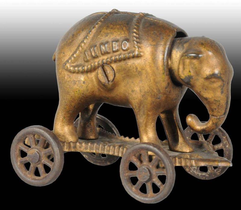 Appraisal: Cast Iron Jumbo on Wheels Semi-Mechanical Bank Description Manufactured by