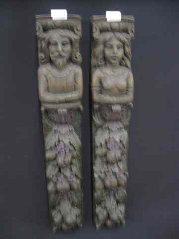 Appraisal: Pair of Carved Wooden Archetuctual Pieces man woman above fancy