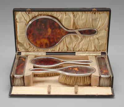 Appraisal: Silver-mounted tortoise dresser set fitted case four brushes hand mirror