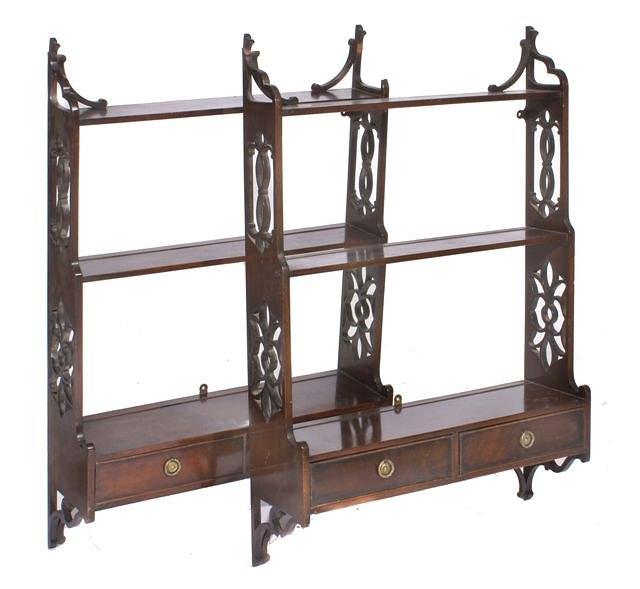 Appraisal: A PAIR OF MAHOGANY THREE TIER WALL SHELVES each with