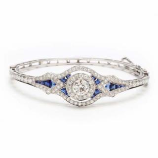 Appraisal: Platinum Diamond and Synthetic Sapphire Bracelet Kirk of hinged bangle