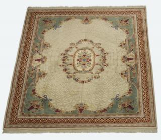 Appraisal: Hand-knotted French style wool rug having foliate swags and baskets