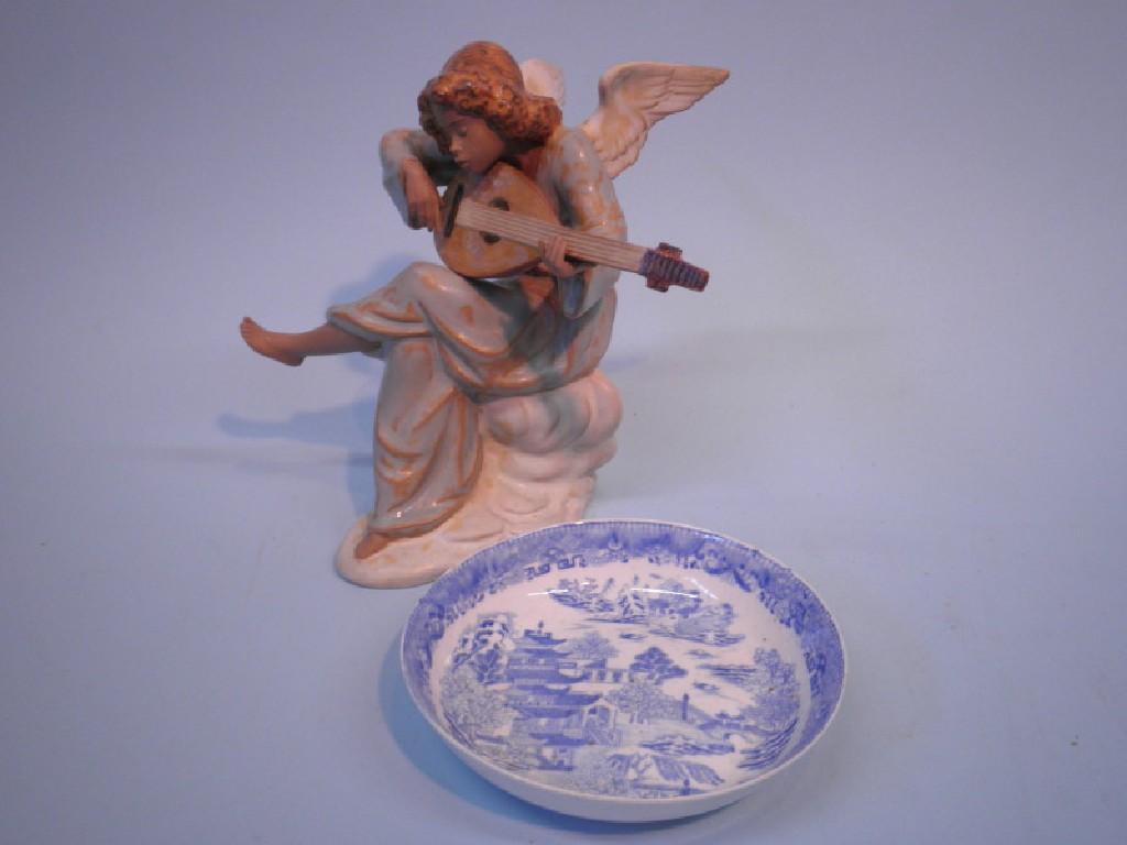 Appraisal: A Lladro pottery figure of a Angel playing a mandolin