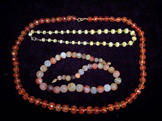 Appraisal: An agate necklet of varying coloured stones and two other