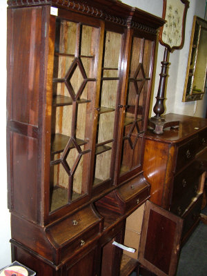 Appraisal: A mahogany display cabinet early th century the dentil moulded