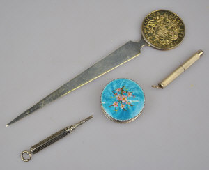 Appraisal: A silver paper knife mounted with a coin to w