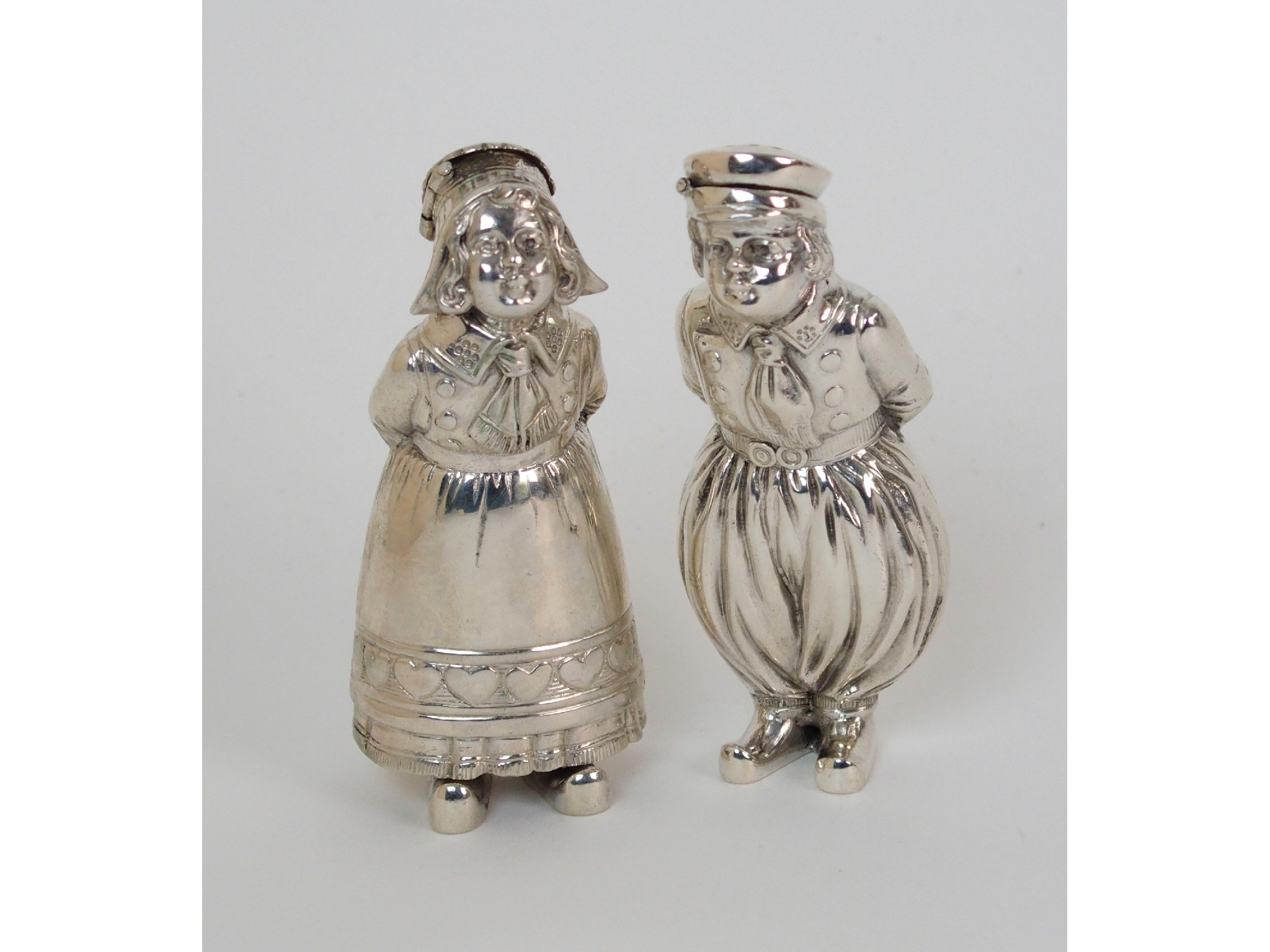 Appraisal: A pair of novelty Continental silver pepperettesmarked with a three