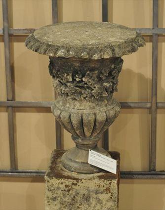 Appraisal: PAIR OF BATH STONE ORNAMENTAL URNS On socles and associated