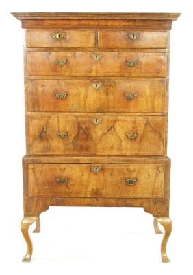 Appraisal: A walnut chest on stand the moulded cornice above two