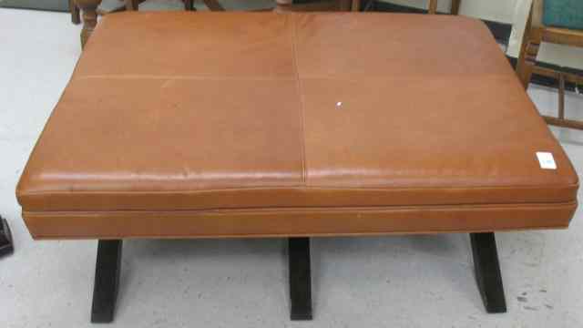 Appraisal: LEATHER COFFEE TABLE OTTOMAN having a rectangular brown leather cushion