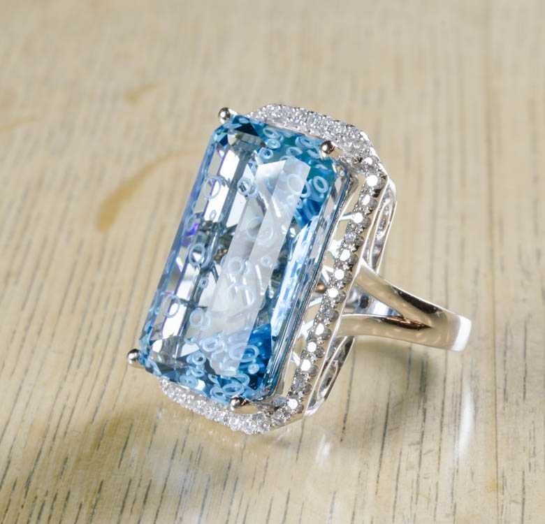 Appraisal: BLUE TOPAZ DIAMOND AND FOURTEEN KARAT GOLD RING The white