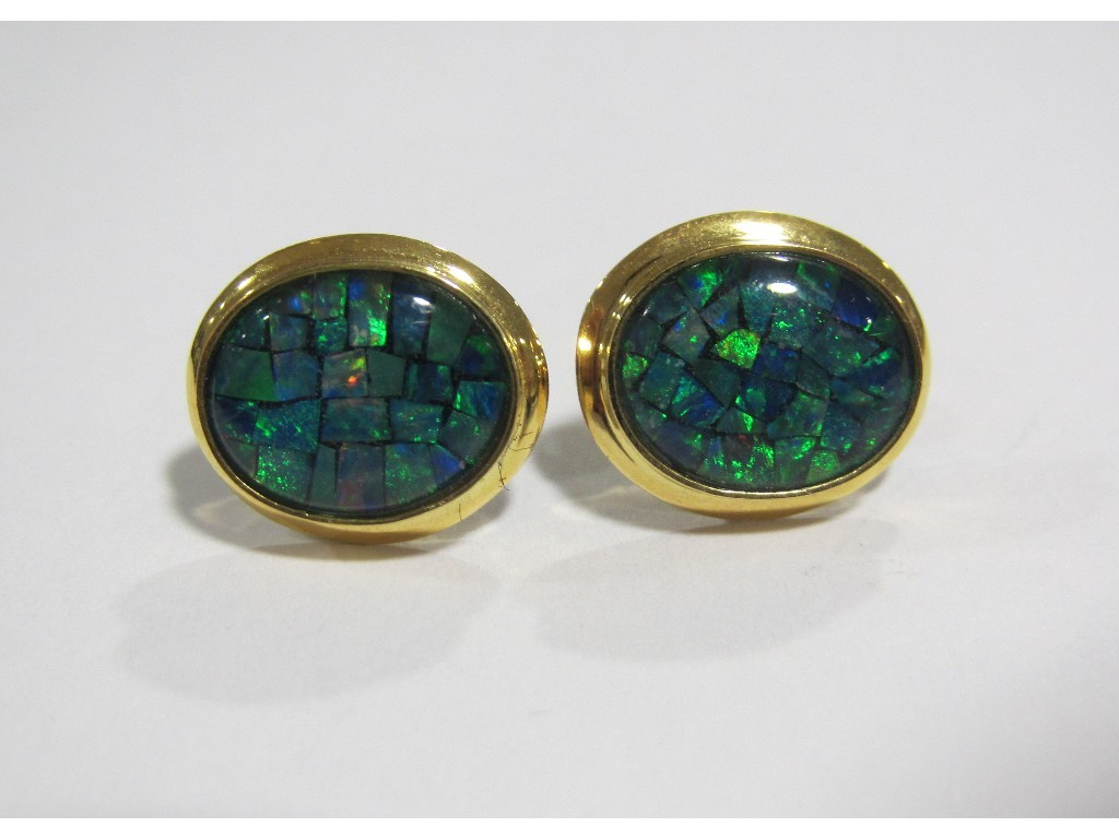 Appraisal: Fourteen carat gold mounted black opal triplet stud earrings