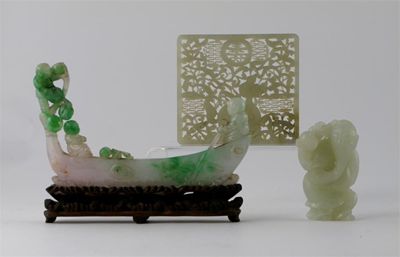 Appraisal: A Chinese jade reticulated plaque carved with a dragon amidst