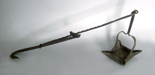 Appraisal: Forged iron fat lamp early th c with corner wick