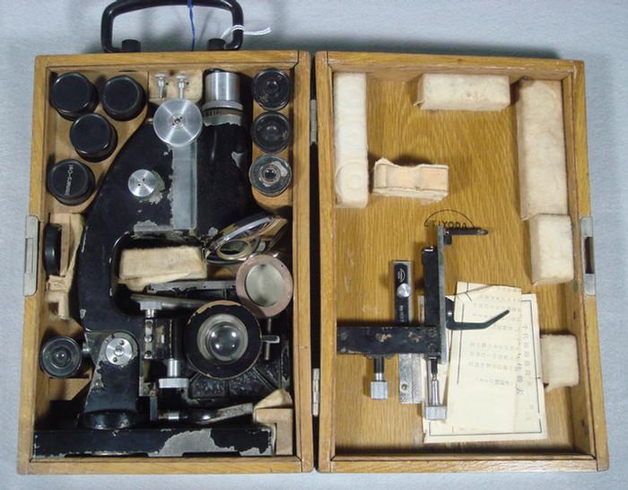 Appraisal: Cased Tiyoda microscope fully fitted with many lenses x Estimate